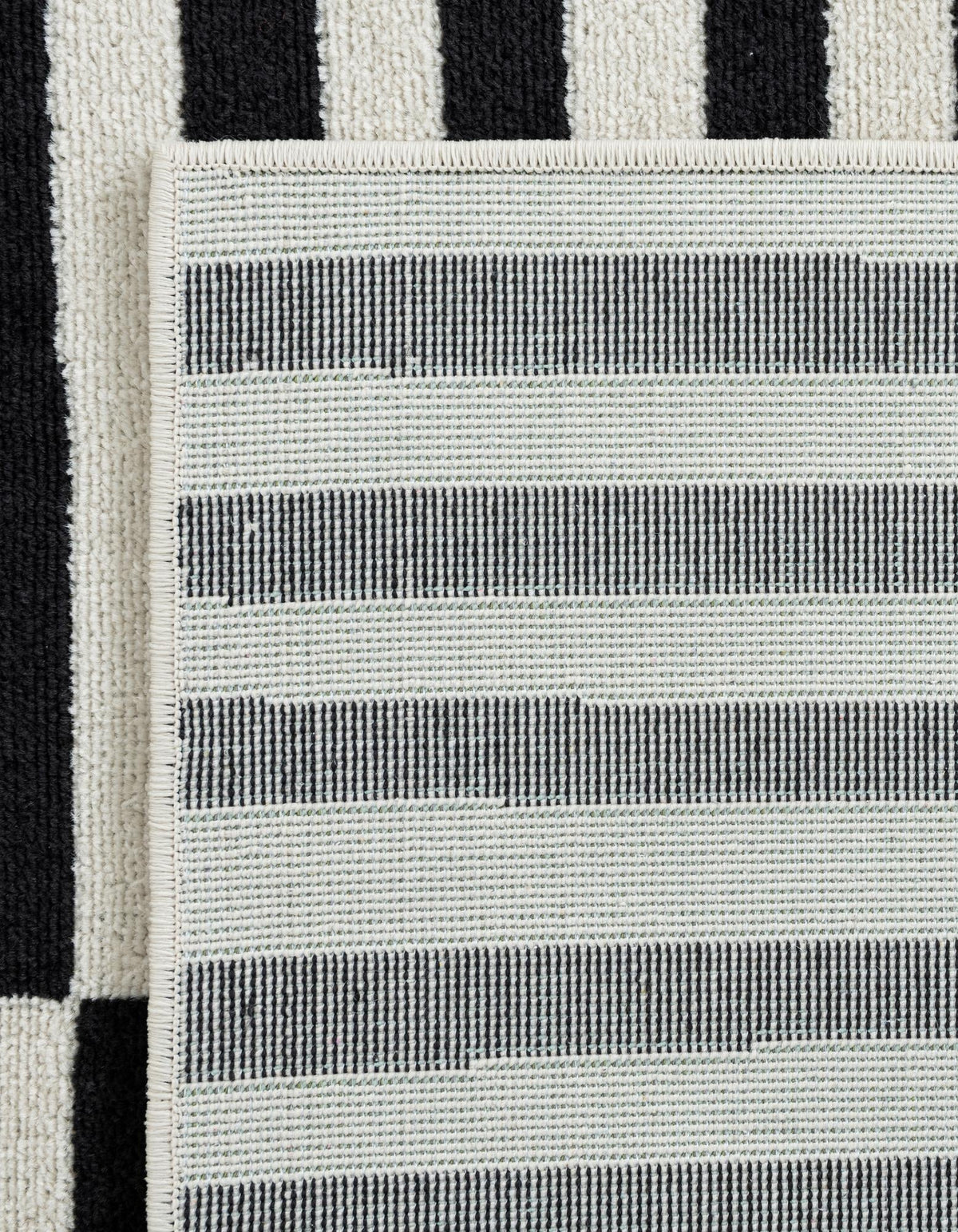 Quadratisch Teppich Tribeca in Schwarz von Hadorn™ - Lifestyle Image