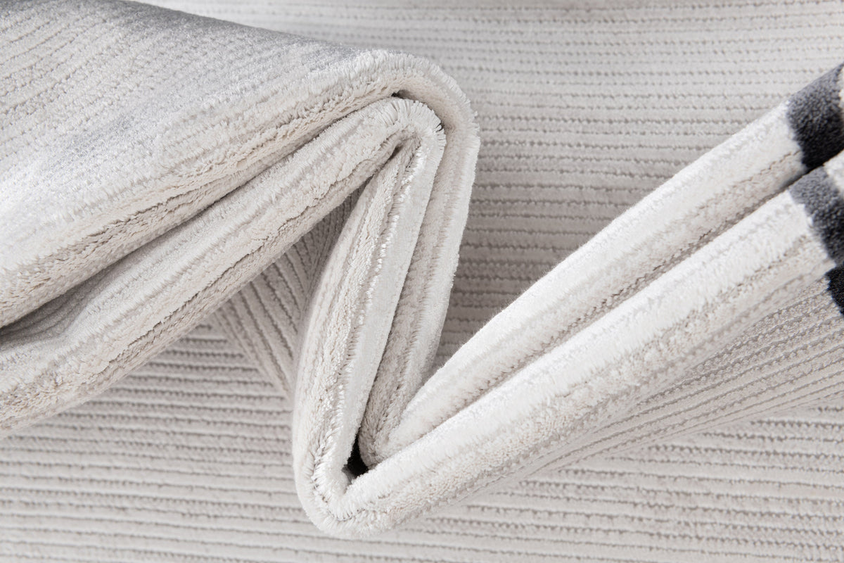 Rund Luxus Teppich Chiasso in Grau von Hadorn™ - Lifestyle Image